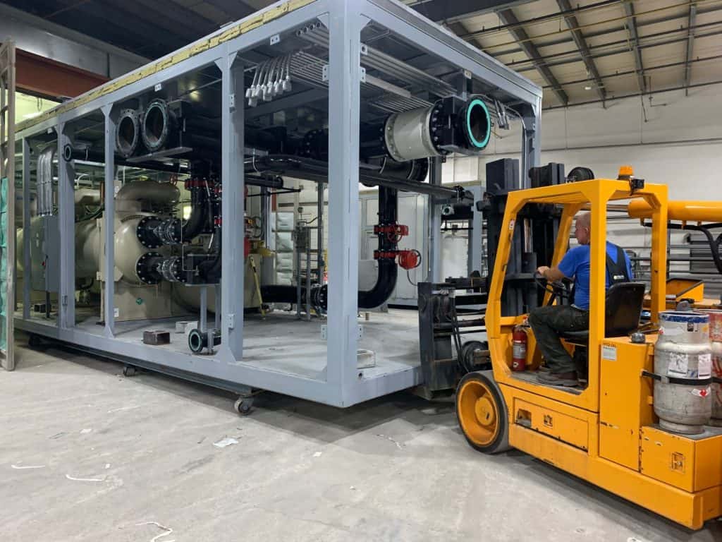 Forklift moving modular plant component